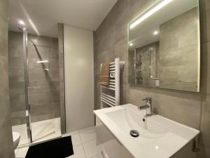 a bathroom with a sink and a shower at Maison proche de la mer in Sainte-Marie-la-Mer +35 photos