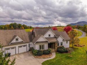 an aerial view of a house with a driveway at Mountain Top at Linville Falls in Newland