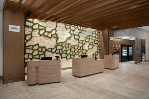 a lobby with a wall with green and white tiles at Courtyard by Marriott San Diego Downtown Little Italy in San Diego