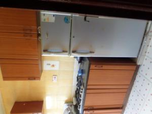 an overhead view of a kitchen with wooden cabinets at Sunshine in Nairobi