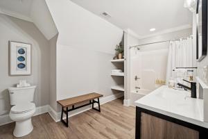 a white bathroom with a toilet and a sink at Paradise Peninsula in Lake Norman of Catawba +32 photos