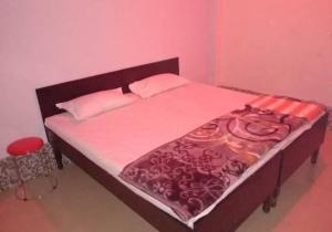 Postel nebo postele na pokoji v ubytování Dev guest house