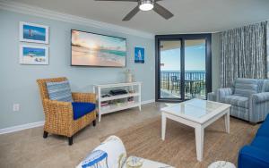 a living room with a view of the ocean at Phoenix East 203 condo in Orange Beach