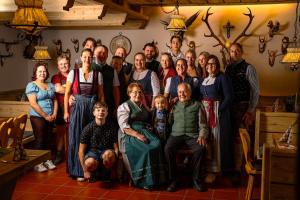 a large group of people posing for a picture at Hotel Baumgartnerhof in Altfinkenstein