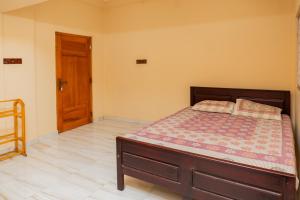 Ένα ή περισσότερα κρεβάτια σε δωμάτιο στο Cheran Villa