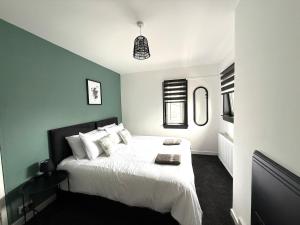 Ένα ή περισσότερα κρεβάτια σε δωμάτιο στο Cosy central house in St Andrews +15 φωτογραφίες