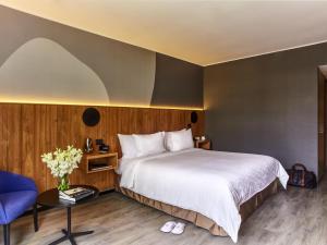 Ένα ή περισσότερα κρεβάτια σε δωμάτιο στο Pullman Lima San Isidro