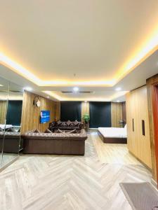 a large room with a large bed and a bed sqor at Luxurious Appartment in GOLDCREST DHA Lahore in Lahore