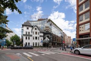 a large white building on a city street at Eurostars Indautxu in Bilbao