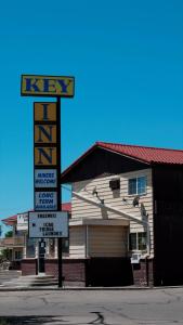 a sign for a k key motel in front of a building at Key Inn in Elko