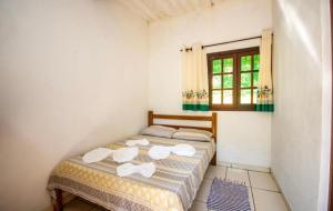Postel nebo postele na pokoji v ubytování Ecolodge Paraty-Mirim + 18 fotografií