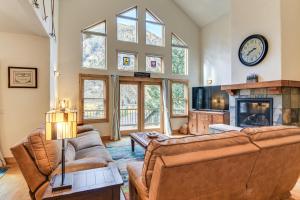 a living room with two couches and a fireplace at Mtn-View Cabin with Private Hot Tub in Georgetown! in Georgetown