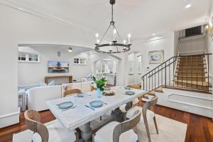a dining room and living room with a table and chairs at 5556 Cypress Point in Kiawah Island