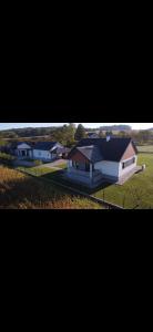 two pictures of a house and a home at Kuća za odmor Husinec in Husinec