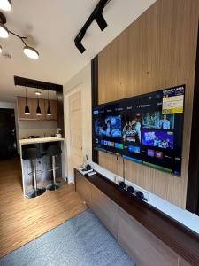 a living room with a large flat screen tv at D'living Condotel in Davao City