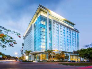 a tall blue building with a lot of windows at Novotel Miami Brickell in Miami