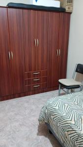 En eller flere senge i et værelse på Casa Rawson