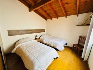 En eller flere senge i et værelse på Patagonien Alquiler Temporario