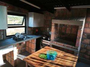 Η κουζίνα ή μικρή κουζίνα στο Eden Village Lodge