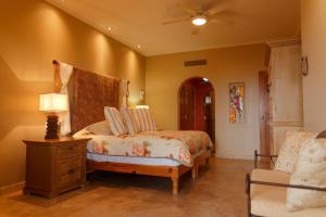 a bedroom with a bed and a ceiling fan at Las Mañanitas LM F4404 in San José del Cabo +22 photos