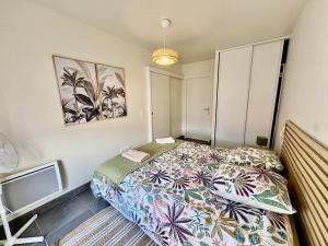 Ένα ή περισσότερα κρεβάτια σε δωμάτιο στο Le Cosy Zen des Sables