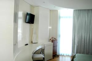 TV a/nebo společenská místnost v ubytování Hotel Excelsior