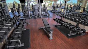 a gym with rows of exercise equipment on a wooden floor at Westgate Lake Resort and Spa ORLANDO in Orlando