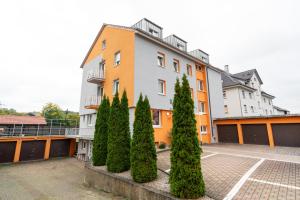 a building with trees in front of it at Hotel Lichtblick Salach in Salach