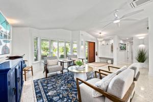 a living room with a couch and a table at Beach Palm Villa - 5533 in Siesta Key
