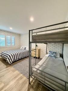 a bedroom with two bunk beds in a room at Mooloolaba Waterfront Unit - sleeps 8 in Mooloolaba