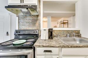 a kitchen with a stove and a sink at Less Than 2 Mi to UMass Health and Dtwn Traveling Pros Hub in Worcester