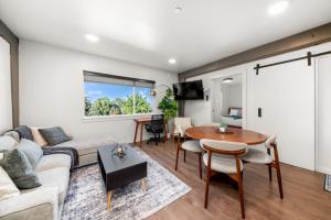 a living room with a couch and a table at 2BR in Downtown with Parking in Spokane