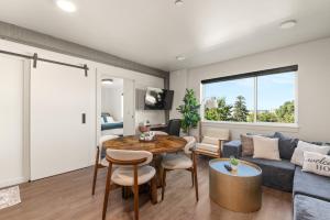 a living room with a table and a couch at 2BR Apartment in DT with Parking in Spokane