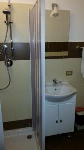 a bathroom with a shower and a sink at B&B Korsal in Noto Marina