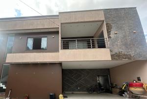 a large house with a balcony and a garage at Aluguel na cop30 in Ananindeua