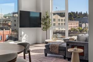 a living room with a couch and a large window at Parkview409 in Spokane