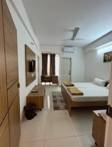 Ένα ή περισσότερα κρεβάτια σε δωμάτιο στο The Grand Inn