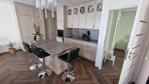 Televisyen dan/atau pusat hiburan di Audronašos apartamentai - self cheking- Gargžduose