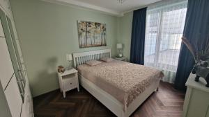 Katil atau katil-katil dalam bilik di Audronašos apartamentai - self cheking- Gargžduose