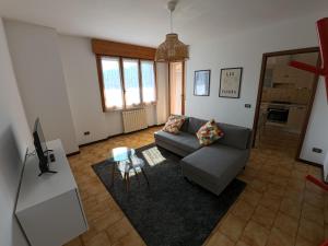 a living room with a couch and a table at Casa Giulia in Domodossola
