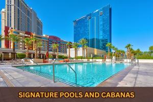 a swimming pool in a city with tall buildings at MGM Signature 31st Flr , Strip View in Las Vegas