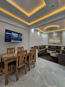 a living room with a table and a couch at Appartement Casa in Essaouira +13 photos