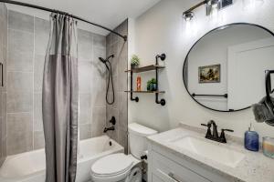 a bathroom with a sink and a toilet and a mirror at Mtn Bikers Escape! 7 Mi to Kokopelli Loops Trails in Fruita +17 photos