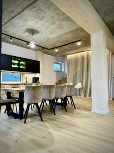 a dining room with a table and chairs at Chalet Horizont in Ižipovce +39 photos