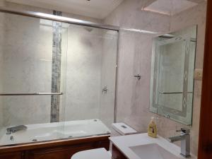 a bathroom with a shower and a toilet and a sink at Hilltop Bellavista, Suite Three, the best choice in Cuenca +26 photos