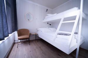 Una cama o camas en una habitación de 1908 Hostel 36 fotos más