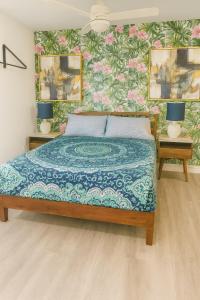 a bedroom with a bed and two tables with lamps at Relaxing Retreat in Sunny Bonita Springs in Bonita Springs