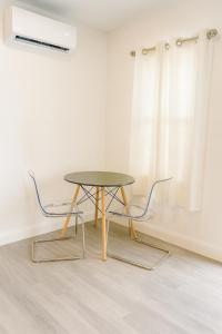 a table and two chairs in a room at Relaxing Retreat in Sunny Bonita Springs in Bonita Springs