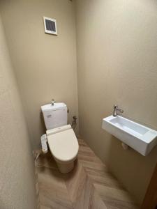 a bathroom with a toilet and a sink at Fujimi no Oka Auto Campsite - Vacation STAY 27845v in Fuji