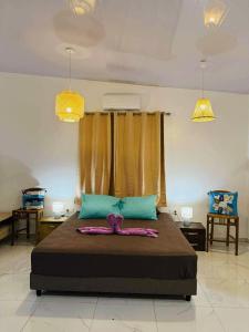 Ένα ή περισσότερα κρεβάτια σε δωμάτιο στο Vaihi's Garden